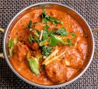 chicken tikka masala in a bowl on a table